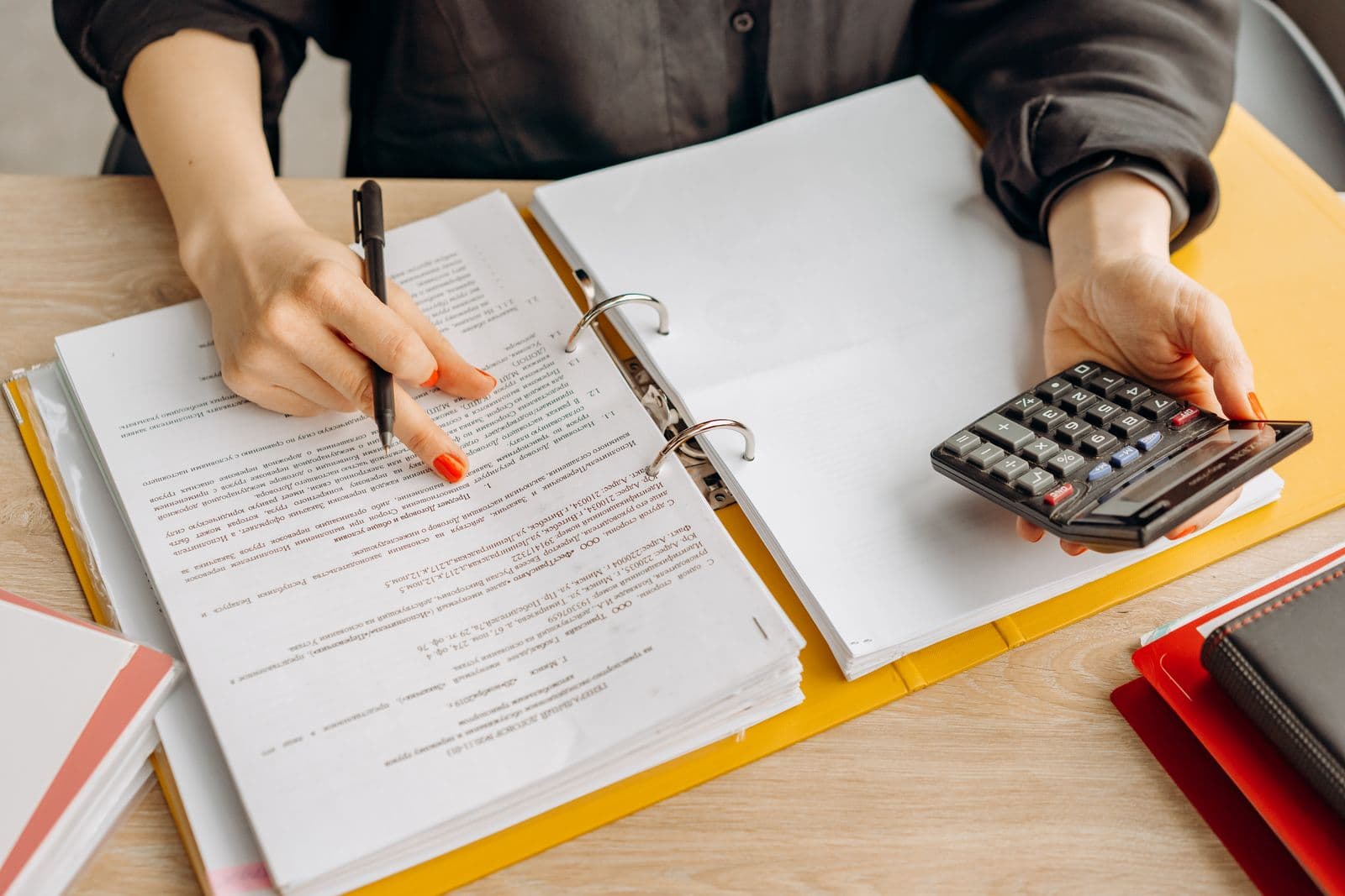 WordPress website design for accounting firms — accountant reviewing financial documents and calculator