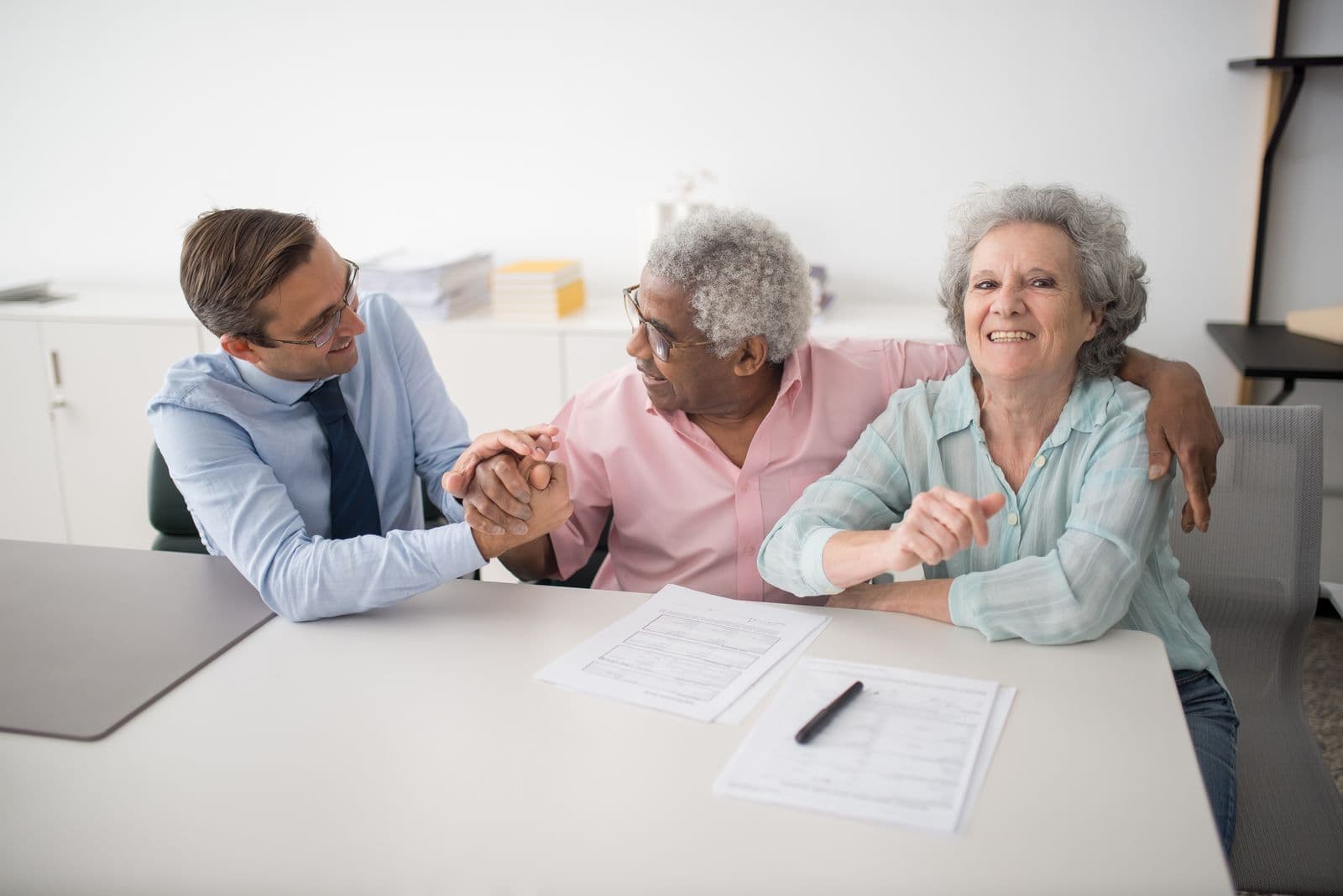 WordPress website design for insurance agencies — advisor walking clients through coverage options